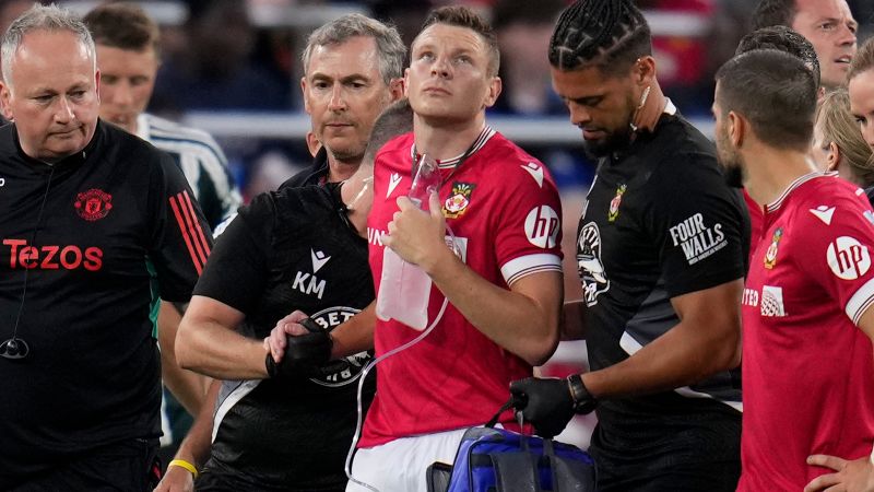 Wrexham manager left ‘fuming’ after striker suffers punctured lung during pre-season victory over Manchester United | CNN