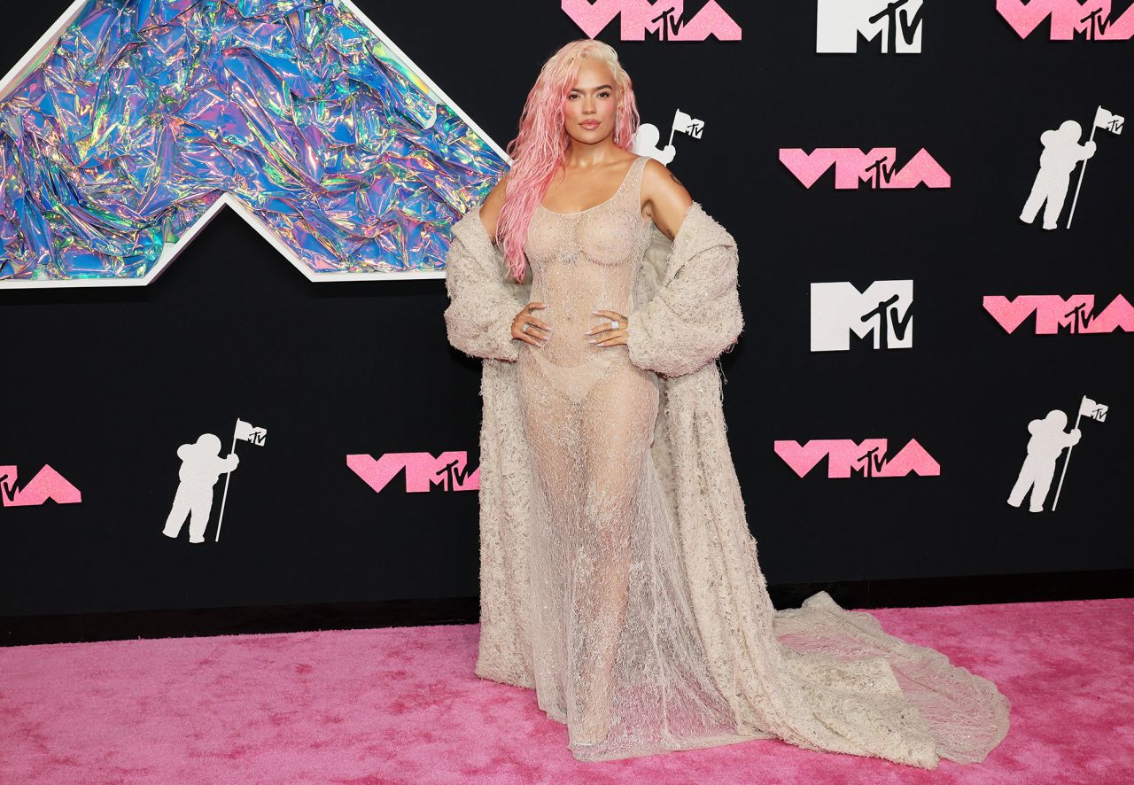 Karol G embraced the see-through trend in a sparkling sheer beige dress by French label Ashi Studio.