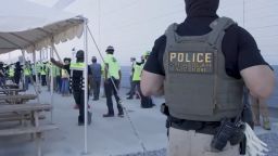 This image from video provided by US Immigration and Customs Enforcement shows manufacturing plant employees being escorted outside the Hyundai plant under construction in Georgia.