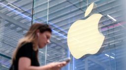 A person walks by the Apple store on Fifth Avenue in New York City on May 1.
