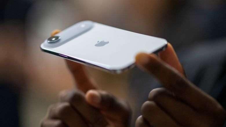 A person holds an Apple iPhone Air during Apple's "Awe-Dropping" event.