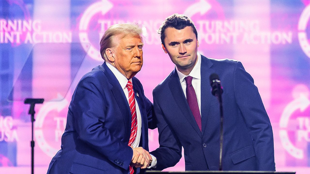 Charlie Kirk (right) appears on stage with President Donald Trump at America Fest 2024 in Phoenix, Arizona, on December 22, 2024.
