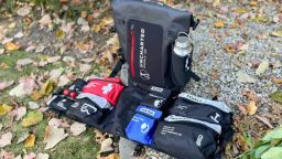 an uncharted supply bug out bag sitting in the grass