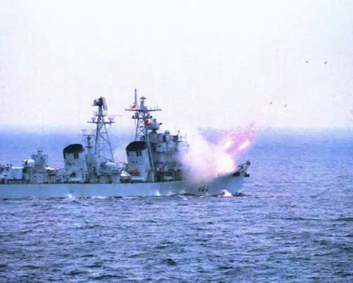 An undated file photo released by China's state news agency Xinhua on March 20 shows a Chinese destroyer firing a missile at a submarine from the sea. 