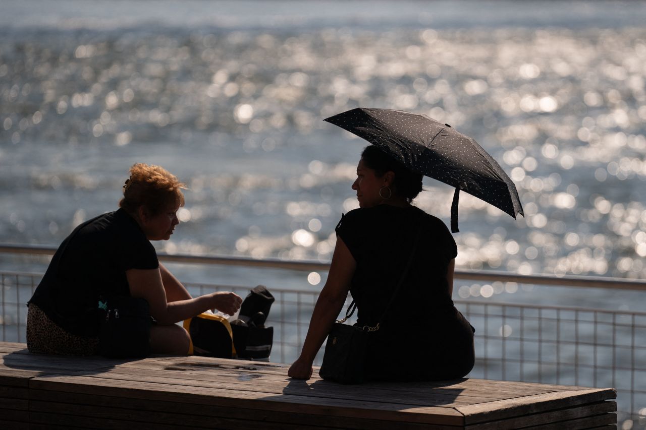 People visit a park in Brooklyn, New York, as a heat wave affects the Northeast, on June 18. 