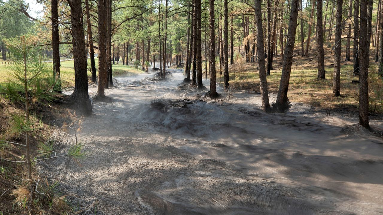 Flash flooding carrying debris, ash and hail through Cedar Creek as the South Fork Fire continues to burn in Ruidoso, New Mexico, on June 19. 