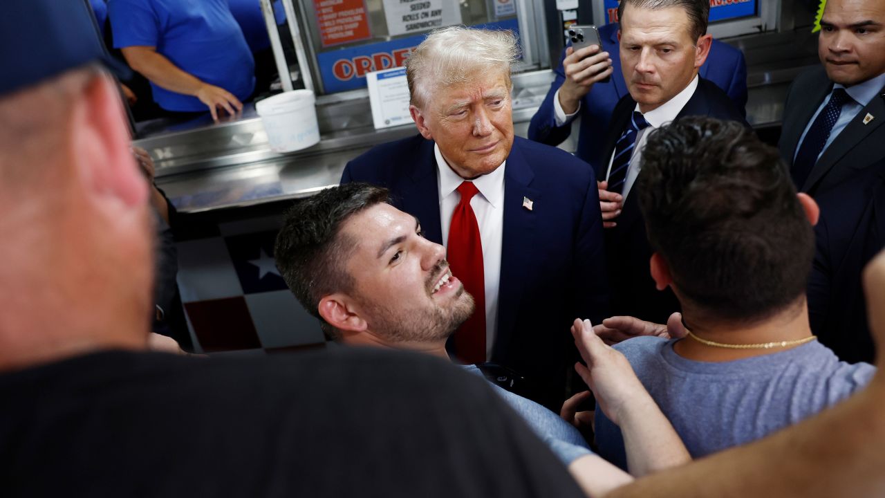 Former President Donald Trump greets supporters at a sandwich stop in Philadelphia on Saturday.