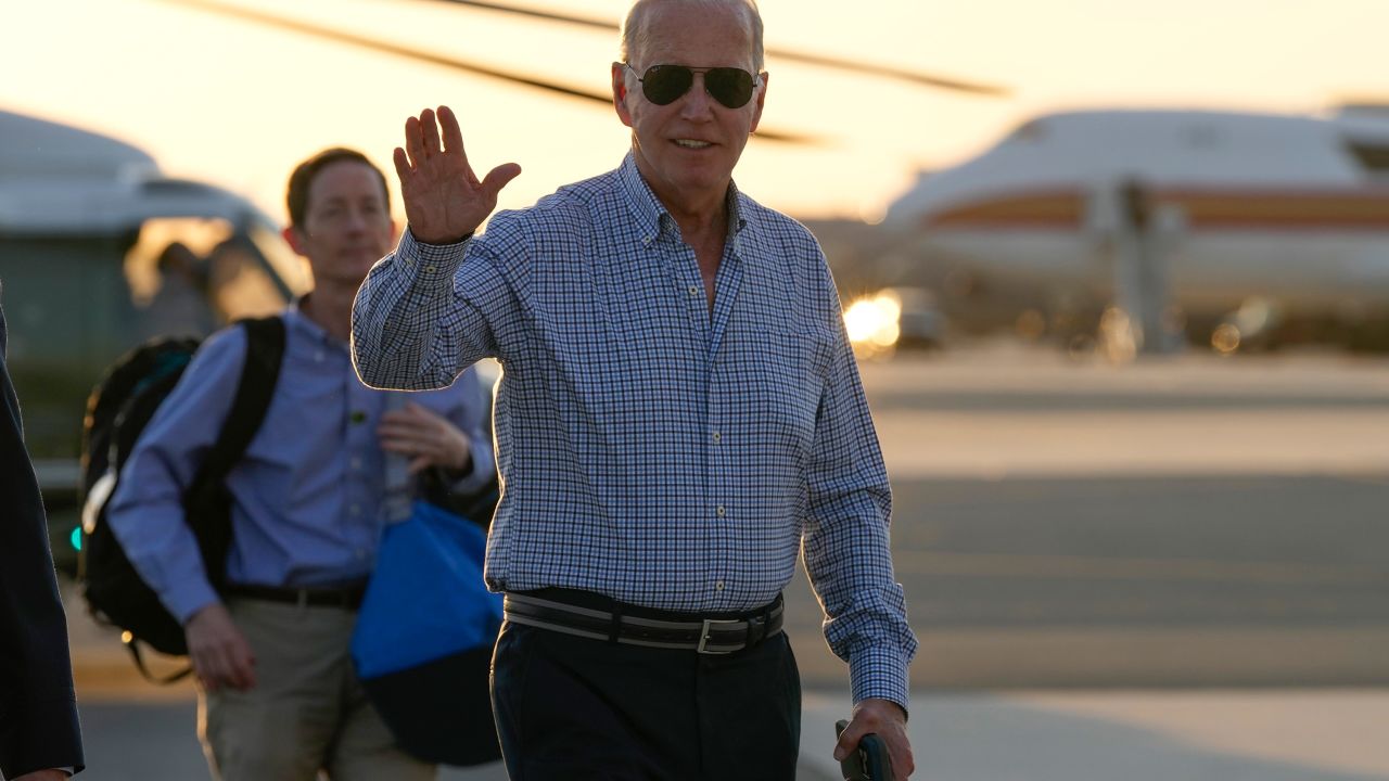 President Joe Biden waves as he walks to board Air Force One at Dover Air Force Base in Delaware before departing for Camp David on June 20.