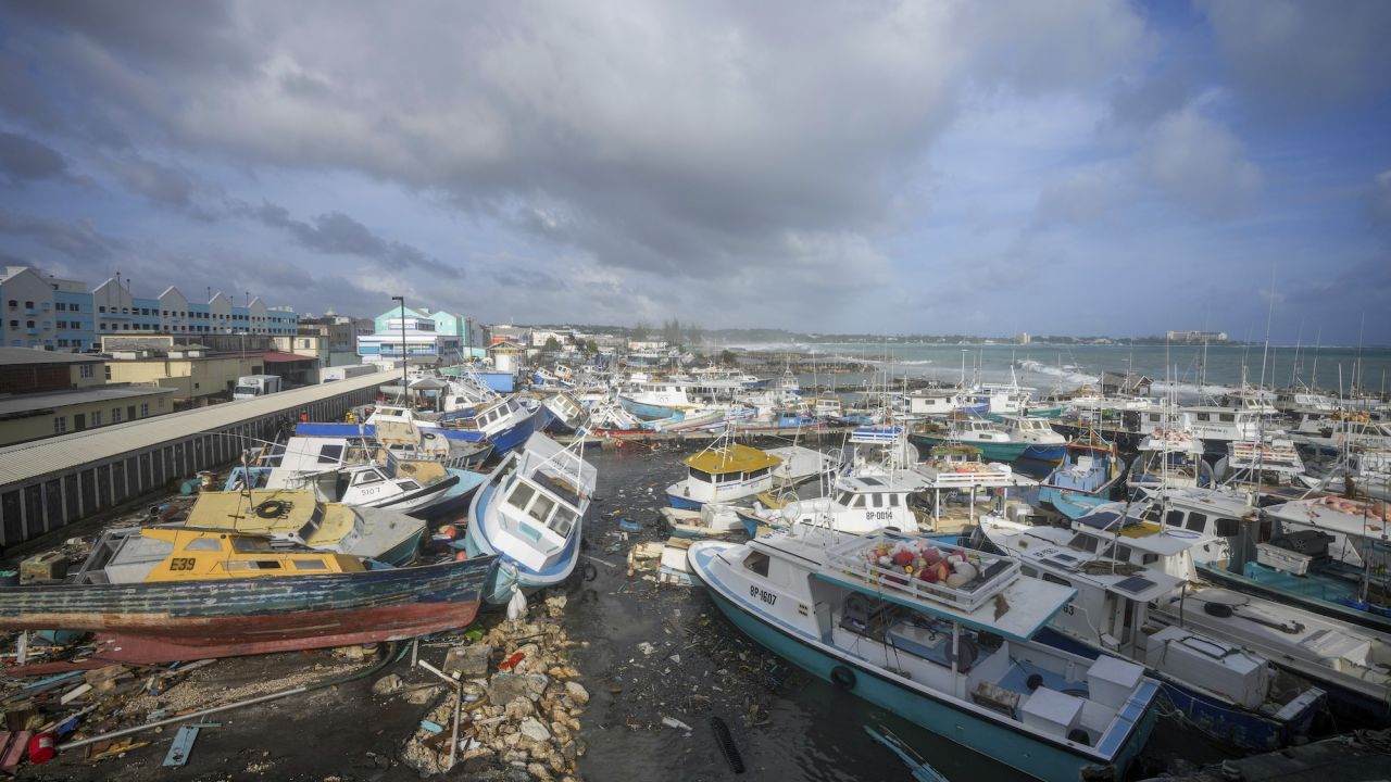 Fishing vessels lie damaged in Barbados on Monday.