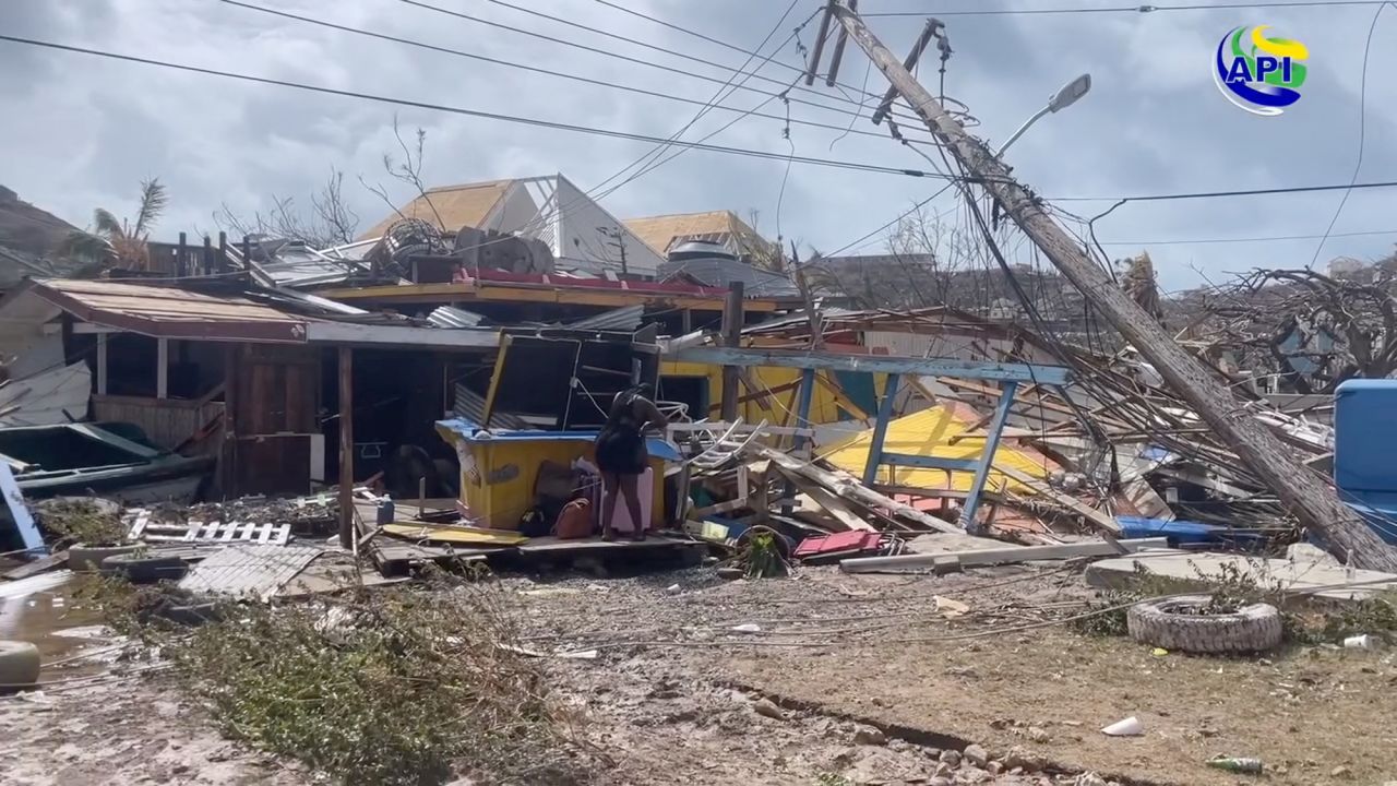 A person stands amidst damaged property following the passing of Hurricane Beryl, in Union Island, Saint Vincent and the Grenadines, in this screen grab taken from a handout video released on July 2.