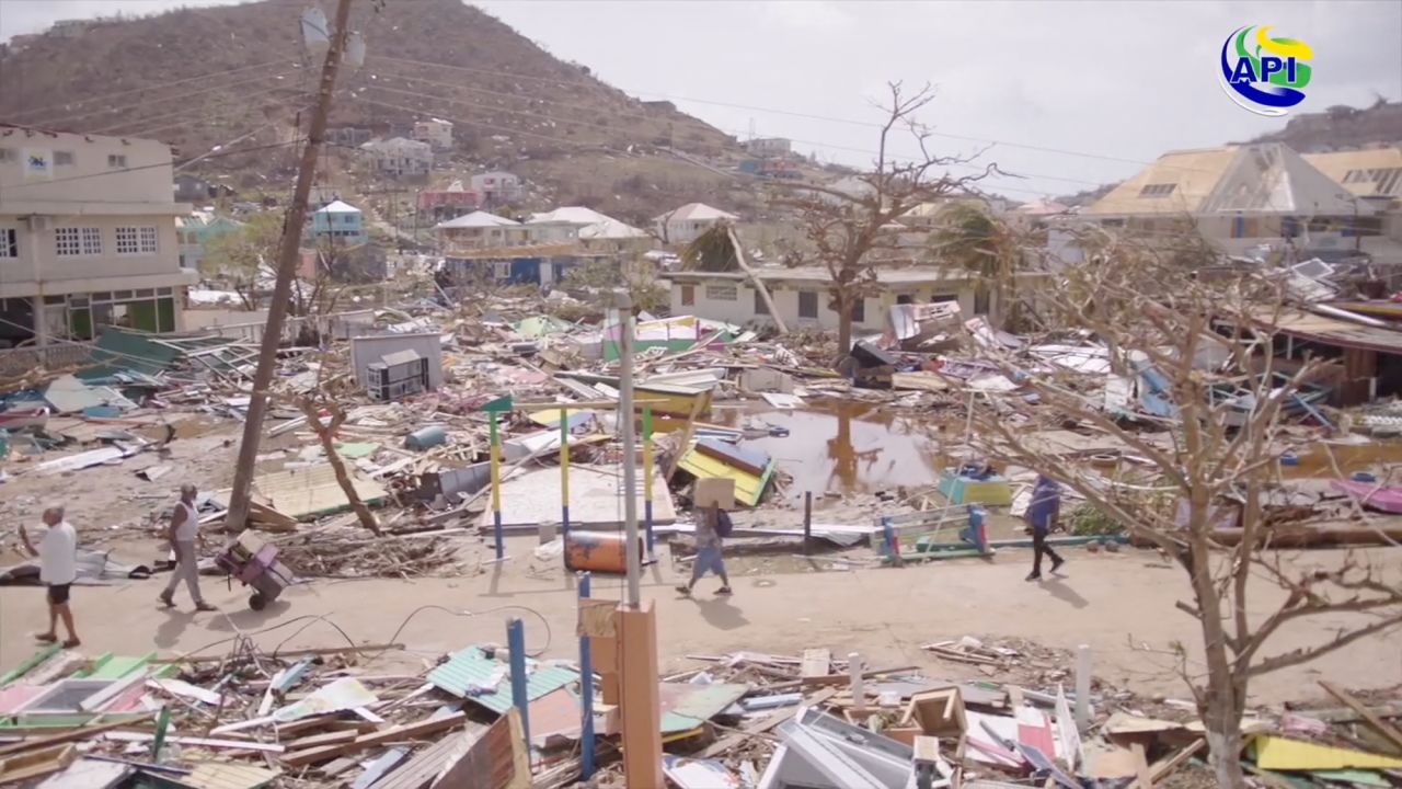 People walk amidst damaged property following the passing of Hurricane Beryl, in?Union?Island, Saint Vincent and the Grenadines, in this screen grab taken from a handout video released on July 2.