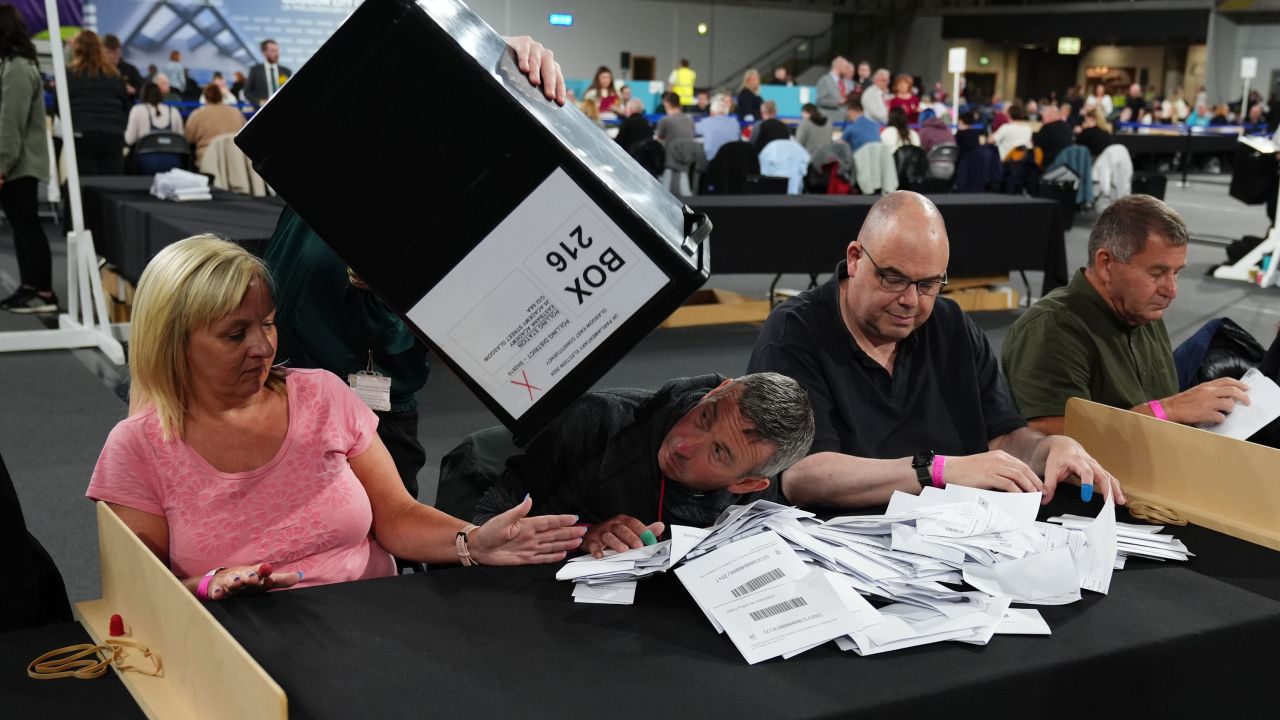 Ballot boxes are emptied at Emirates Arena in Glasgow, Scotland, on Thursday, July 4. 