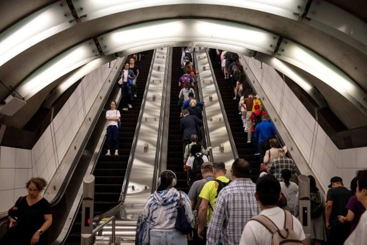 Commuters exit the 72nd Street subway station in New York, on Thursday, June 27.