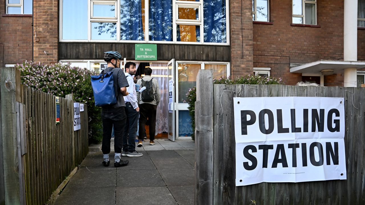 People queue to vote at a polling station in London, England, on July 4.