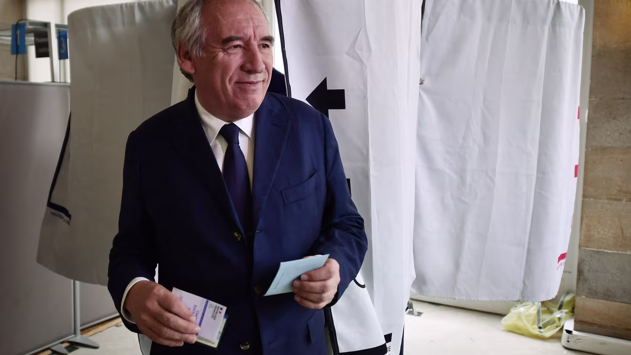 President of the Democratic Movement (MoDem) party and Mayor of Pau Francois Bayrou leaves the polling booth before voting in the second round of France's legislative election at a polling station in Pau, south-western France on July 7.