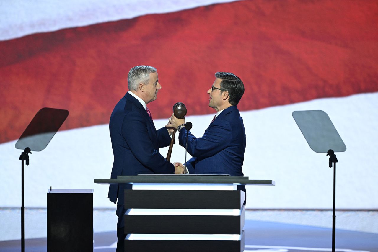  Republican National Committee's chair Michael Whatley gives the gavel to House Speaker Mike Johnson during the first day of the convention on Monday, July 15. 