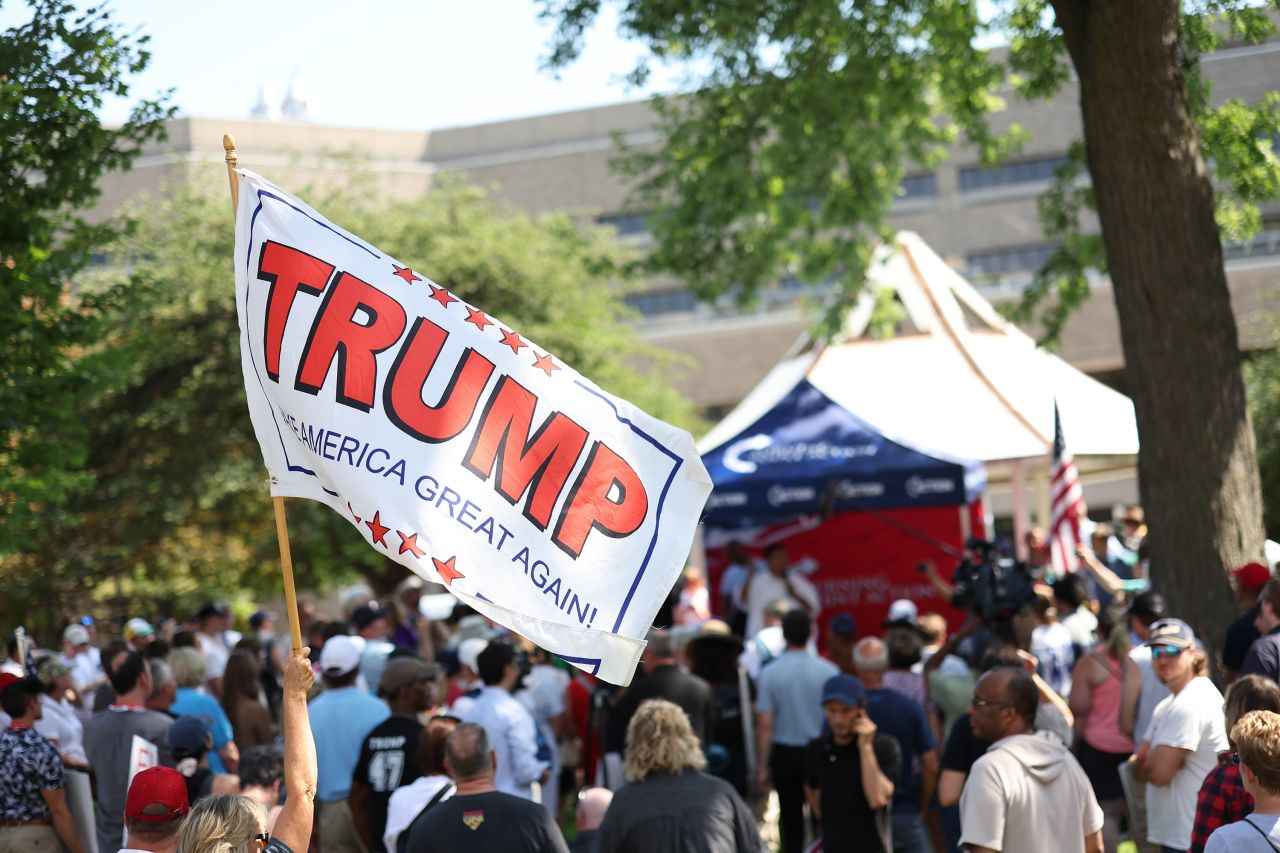 People attend a vigil for Republican presidential candidate former President Donald Trump at Zeidler Union Square on July 14, in Milwaukee, Wisconsin.