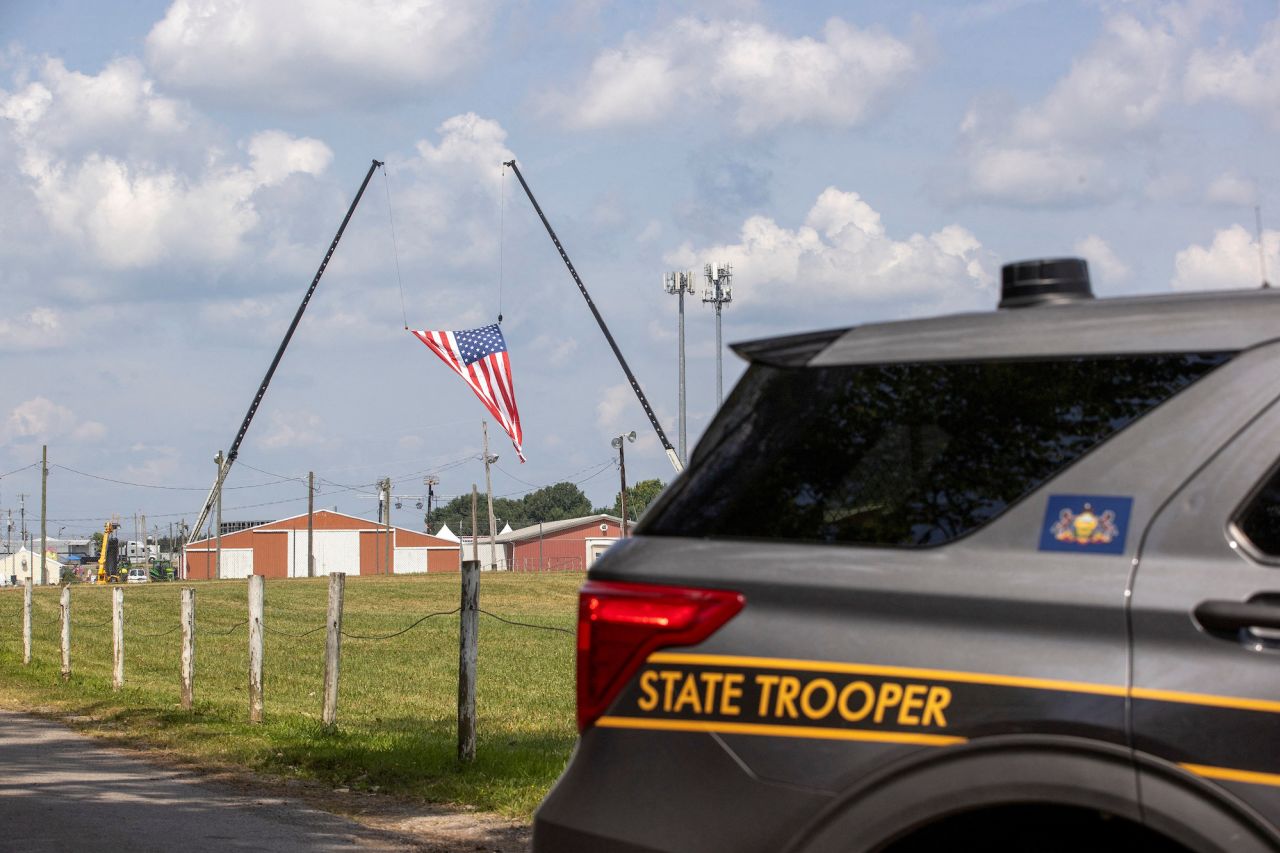 A state trooper blocks a road during the police investigation into gunfire at a campaign rally of Donald Trump in Butler, Pennsylvania, on Sunday.