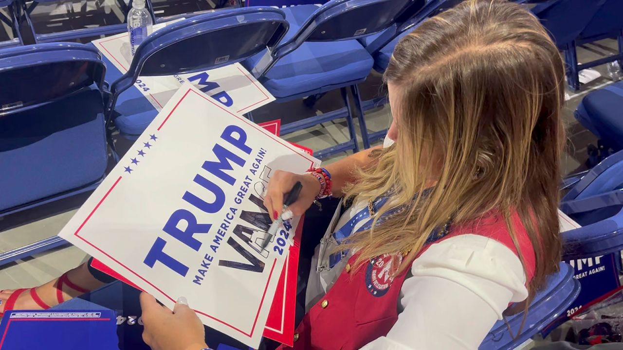  Idaho delegate Kirsten Lucas Idaho delegate adds Vance's name t a Trump sign after the senator was officially nominated.