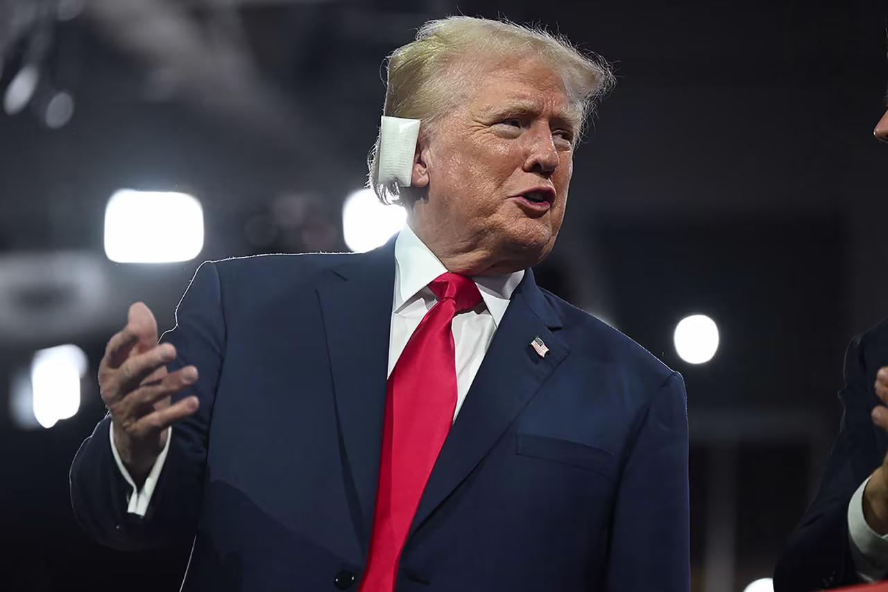 Former US President Donald Trump appears with a bandaged ear on the first night of the Republican National Convention in Milwaukee on July 15.