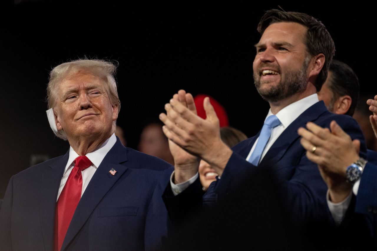 Former President Trump, left, looks at his running mate Sen. JD Vance at the 2024 Republican National Convention hosted at the Fiserv Forum in Milwaukee, Wisconsin, on July 15.