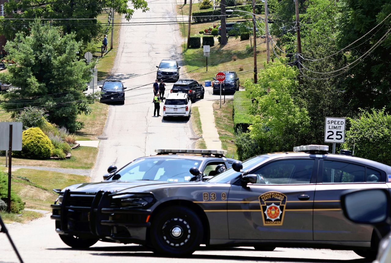 Police vehicles are seen around the house of Thomas Matthew Crooks in Bethel Park, Pennsylvania, on July 14, 2024.