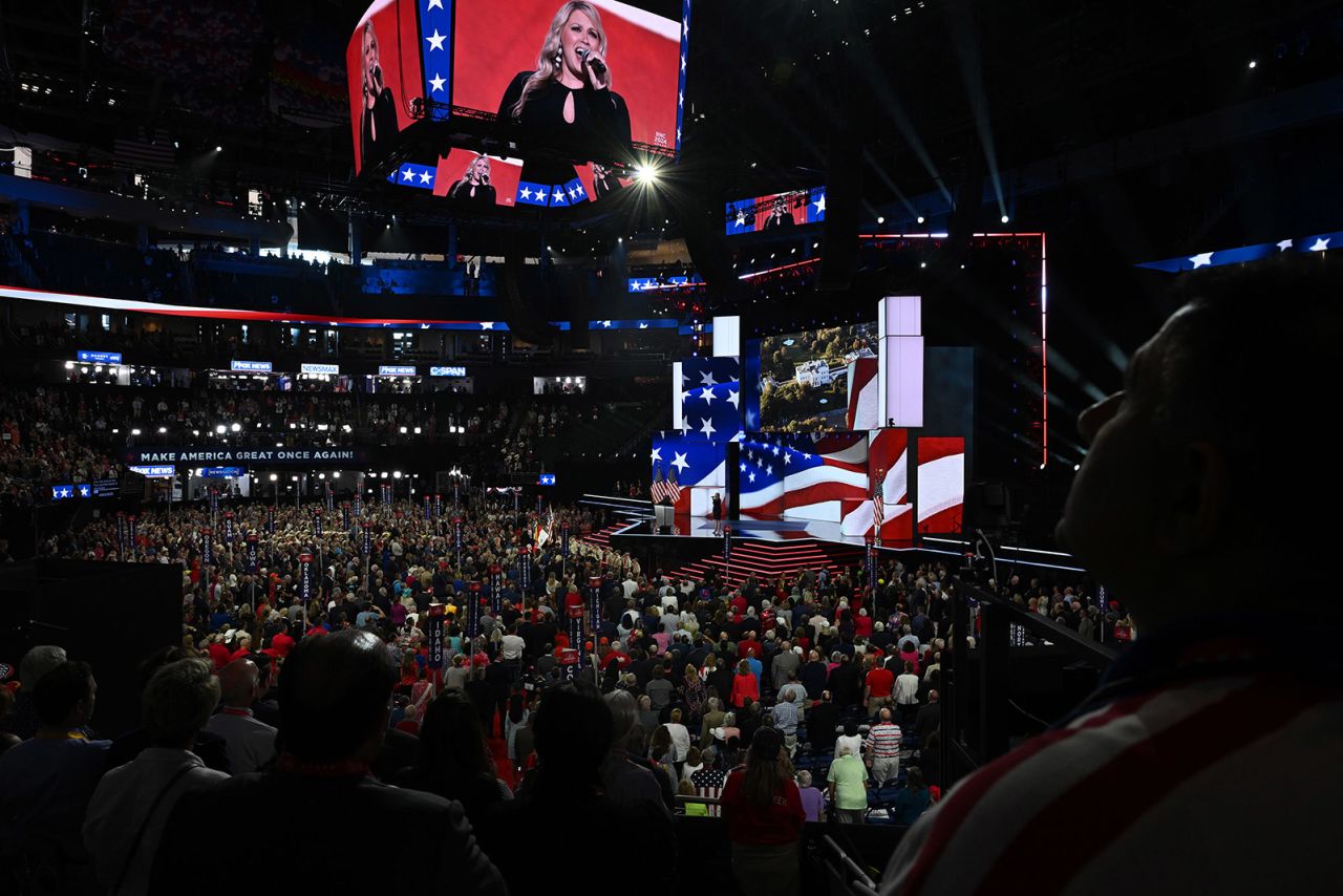 People sing the National Anthem at the 2024 Republican National Convention hosted at the Fiserv Forum in Milwaukee, Wisconsin, on July 17.