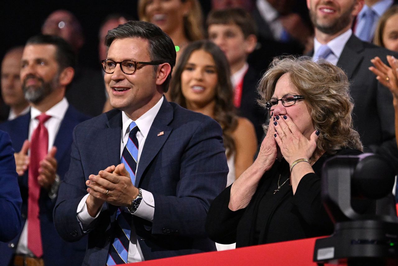 House Speaker Mike Johnson watches Vance's speech next to Vance's mother, Beverly. During his speech, Vance spoke of his mother’s struggle with addiction and acknowledged her where she sat in the VIP box.  