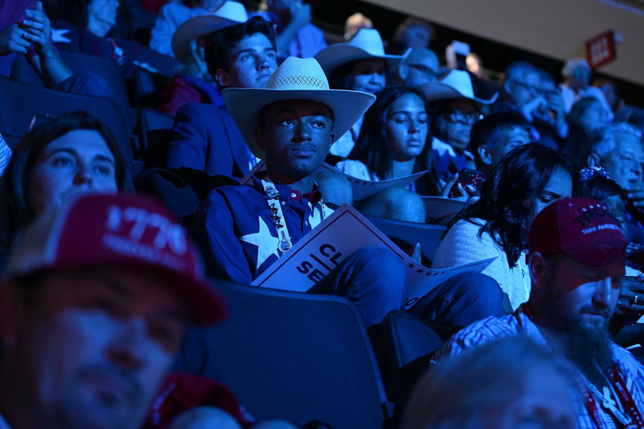 Convention attendees watch Wednesday's events at the Fiserv Forum.?