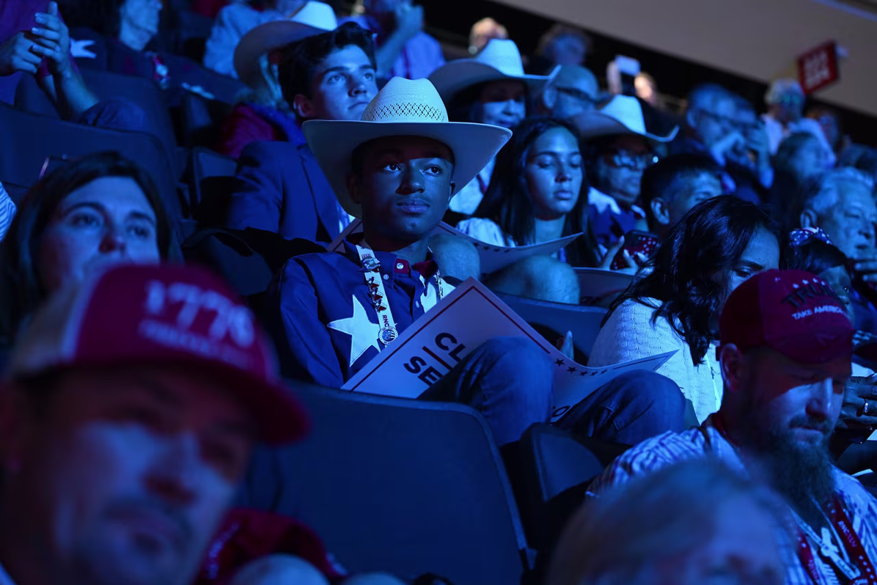 Convention attendees watch Wednesday's events at the Fiserv Forum. 