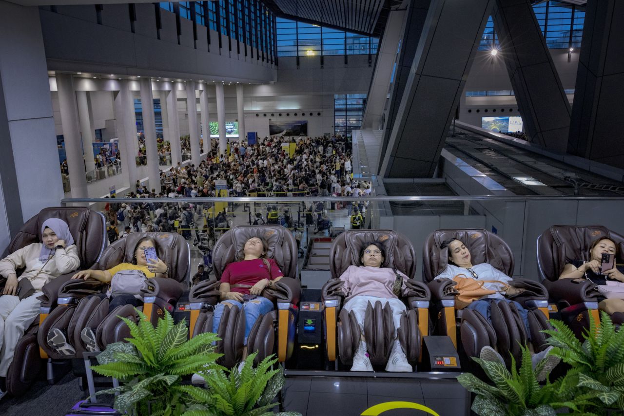 Long lines of passengers form at the check-in counters at Ninoy Aquino International Airport in Manila.