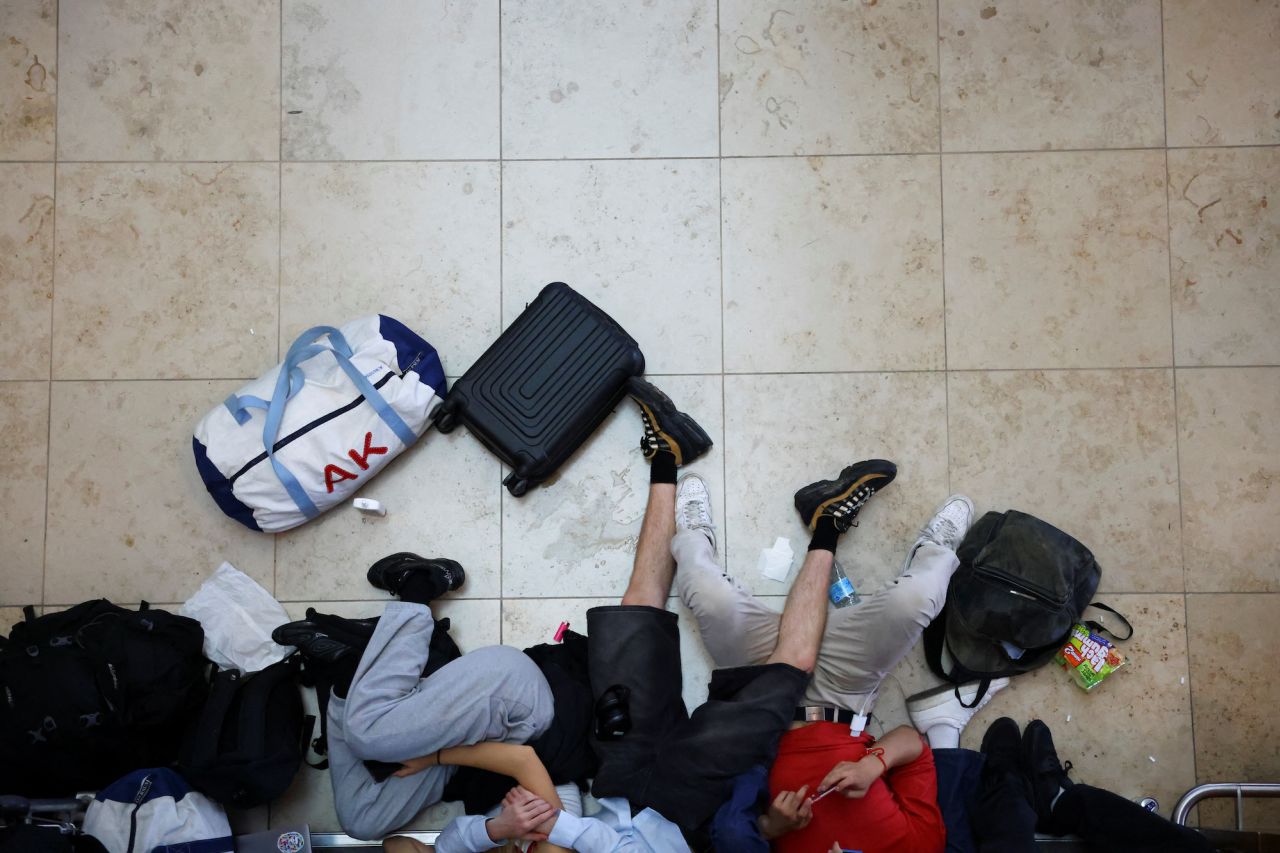 People wait for their flights at Brandenburg Airport in Berlin.