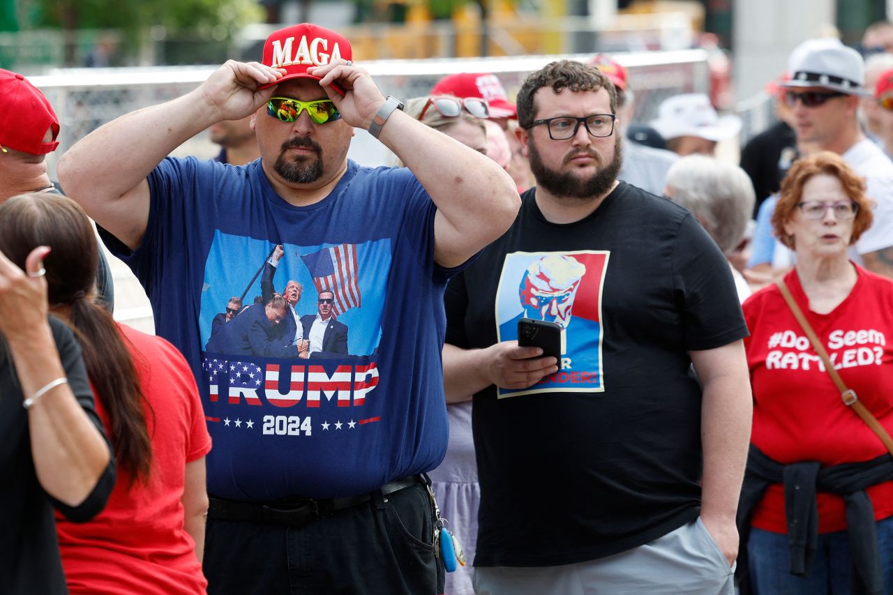 People arrive at Van Andel Arena in Grand Rapids, Michigan, ahead of a campaign rally for former President Donald Trump and running mate JD Vance on July 20. 