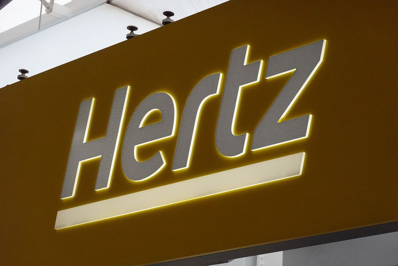 Hertz rental car signage is seen at John F. Kennedy International Airport in Queens, New York City, on March 30, 2022. 