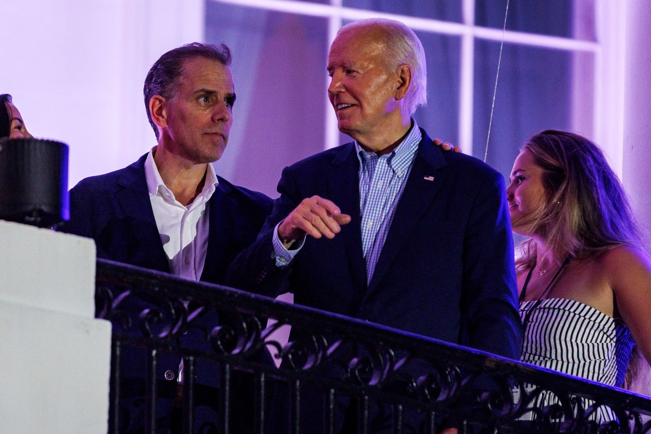 President Joe Biden talks to his son, Hunter Biden, following the fireworks on the National Mall with First Lady Jill Biden and Second Gentleman Doug Emhoff from the White House balcony during a 4th of July event on the South Lawn of the White House on July 4 in Washington, DC.?