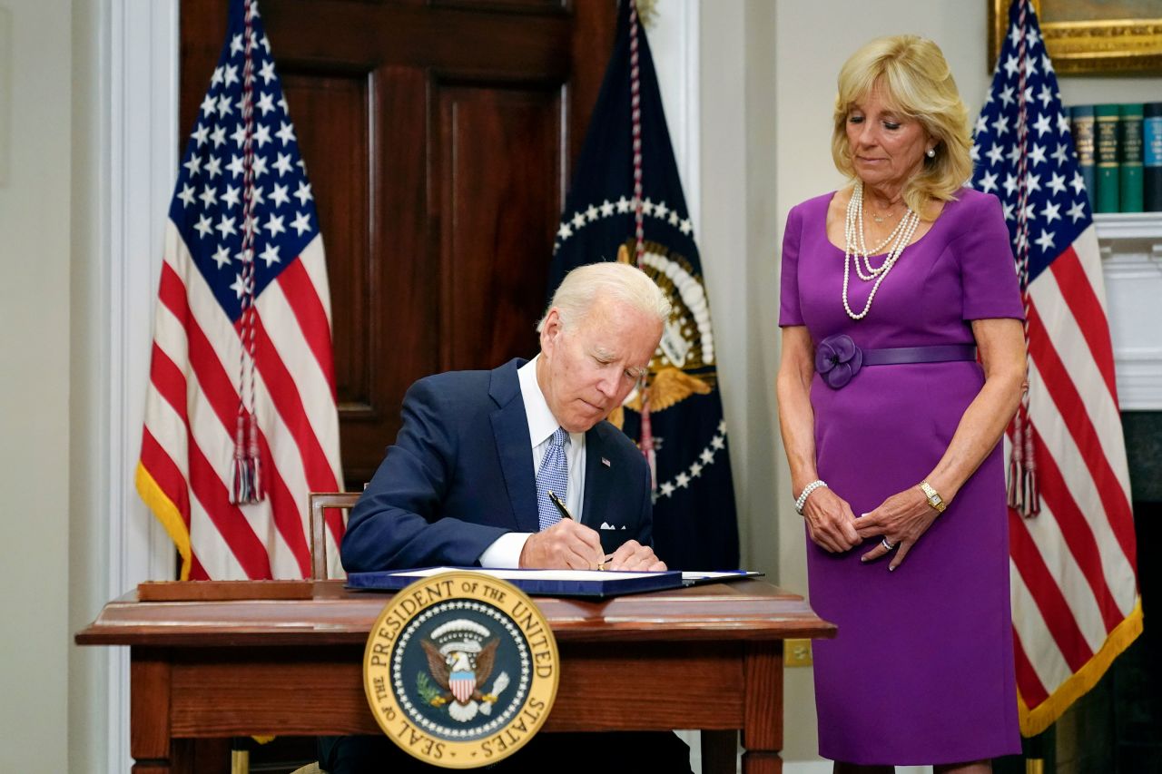 President Joe Biden signs into law the Bipartisan Safer Communities Act gun safety bill in the Roosevelt Room of the White House in Washington, DC, on June 25, 2022. 