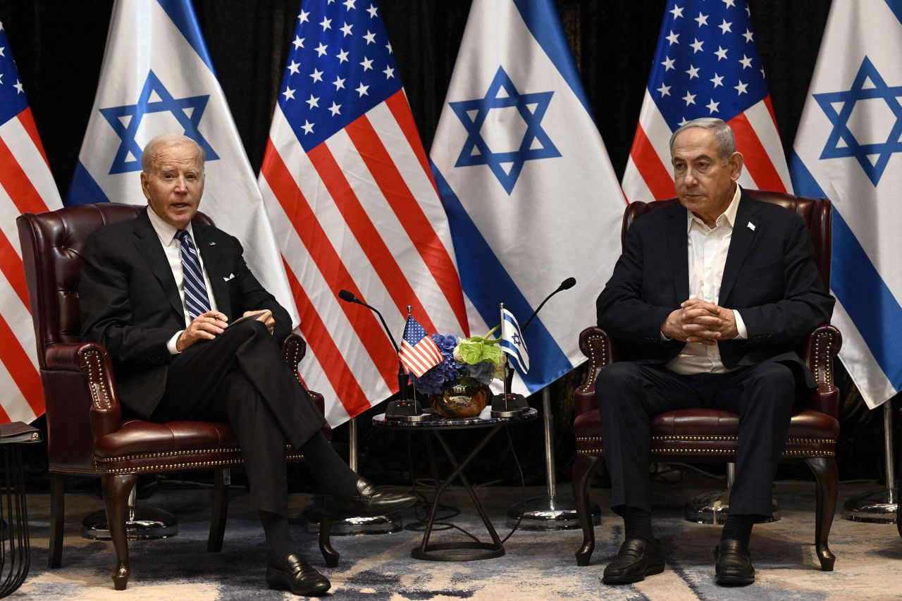 US President Joe Biden and Israeli Prime Minister Benjamin Netanyahu pose for photos during a meeting?in Tel Aviv in October.