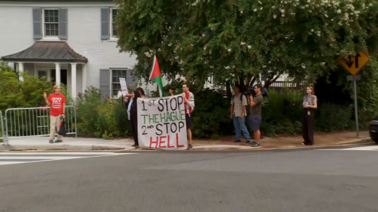 Protesters are seen outside the Washington Hebrew Congregation on Wednesday.