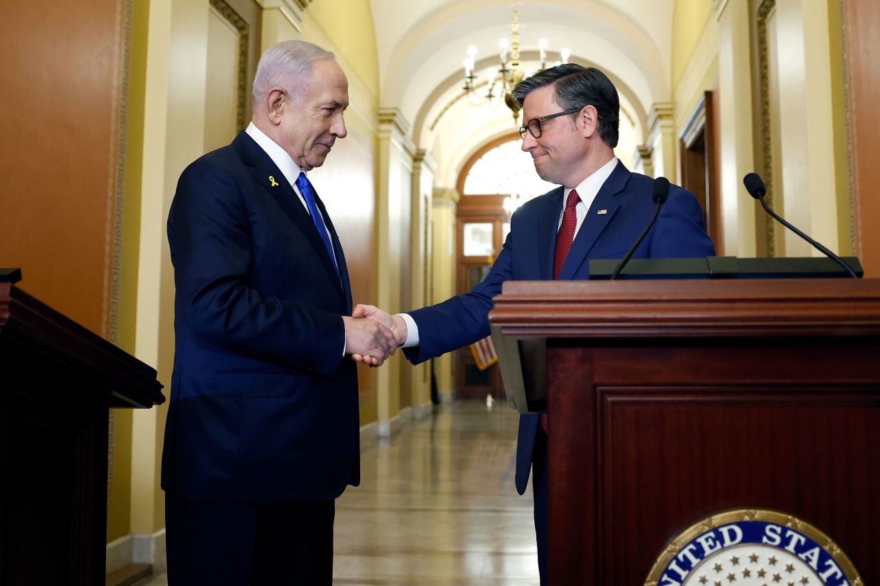 Israeli Prime Minister Benjamin Netanyahu and U.S. Speaker of the House Mike Johnson shake hands before speaking to reporters before a meeting at the U.S. Capitol Building on July 24, 2024 in Washington, DC.