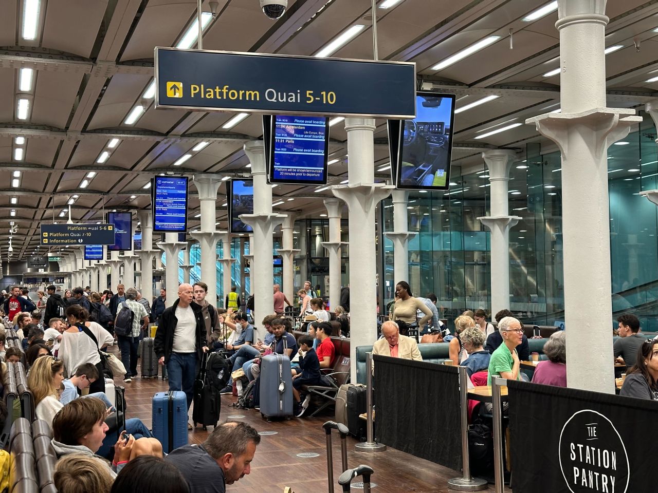 Passengers wait at London's St Pancras Station to catch the Eurostar to Paris on Friday.