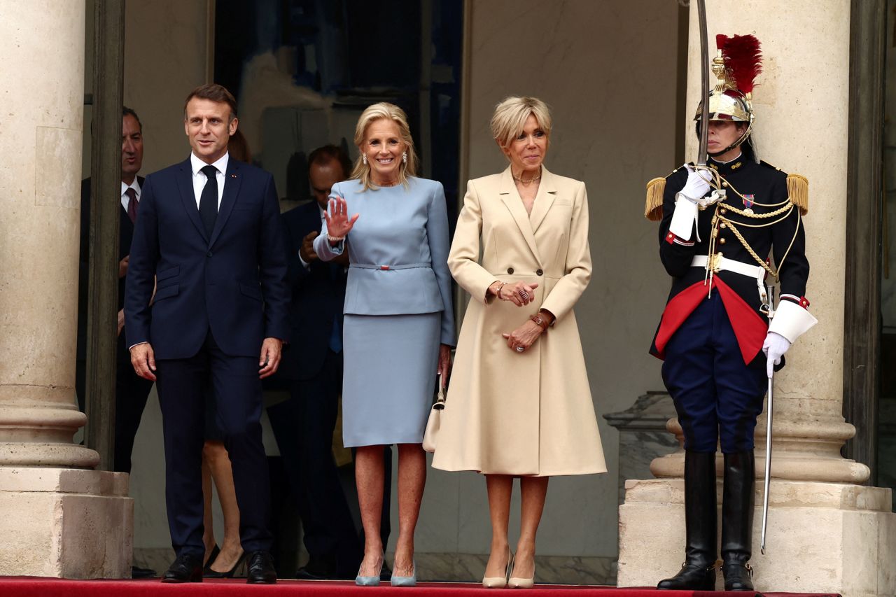 French President Emmanuel Macron and his wife Brigitte Macron pose with U.S. first lady?Jill?Biden?(center) as she arrives to attend a reception for heads of state and government at the Elysee Palace before the opening ceremony of the Paris 2024 Olympic Games on July 26.