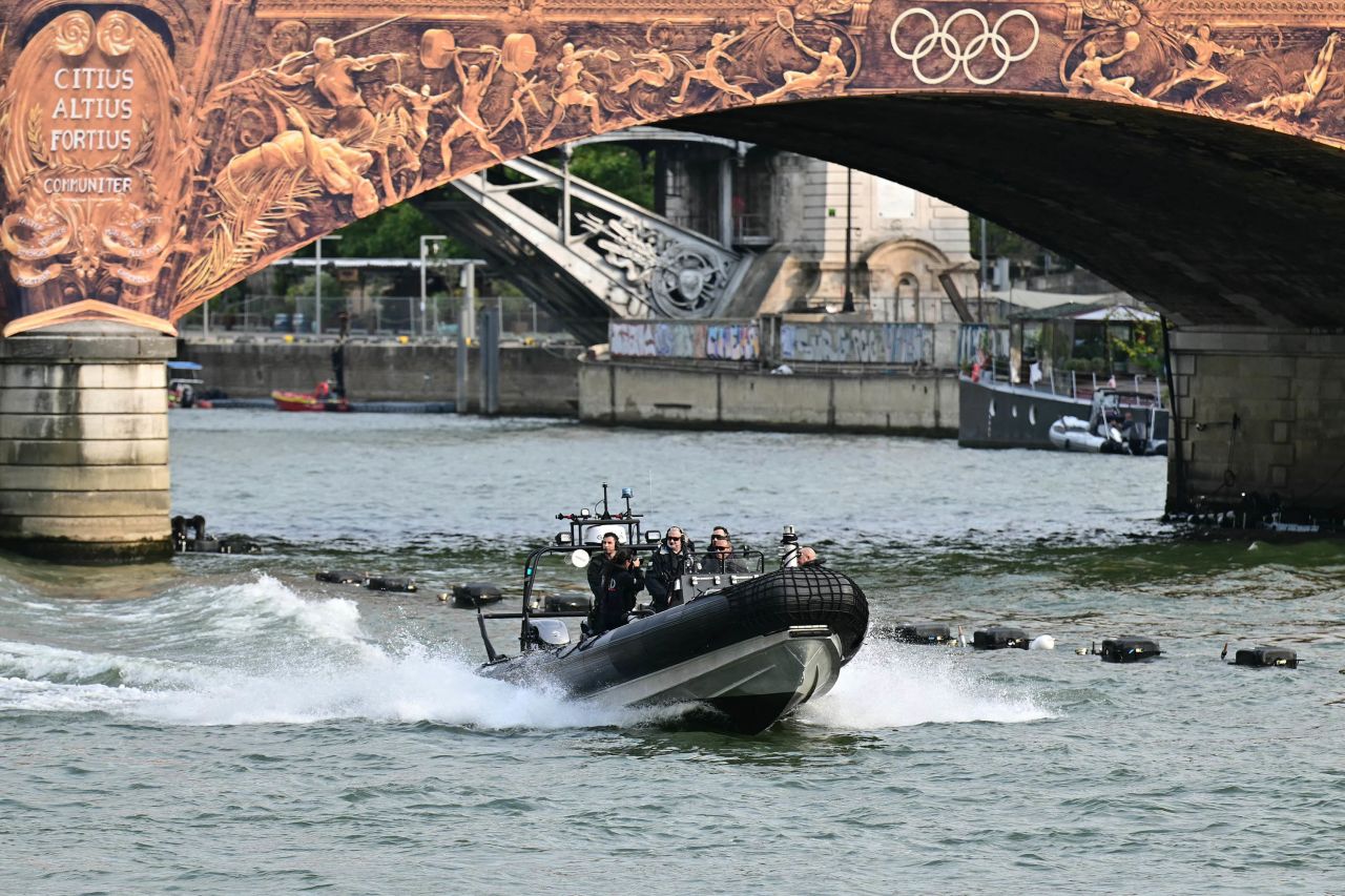 French authorities patrol on a boat on the Seine river, ahead of the Olympic Games in Paris, on July 24. 