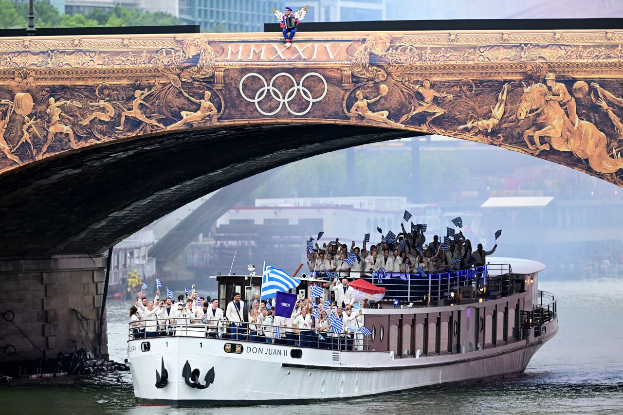 Team Greece are seen at Pont d'Austerlitz during the opening ceremony. 