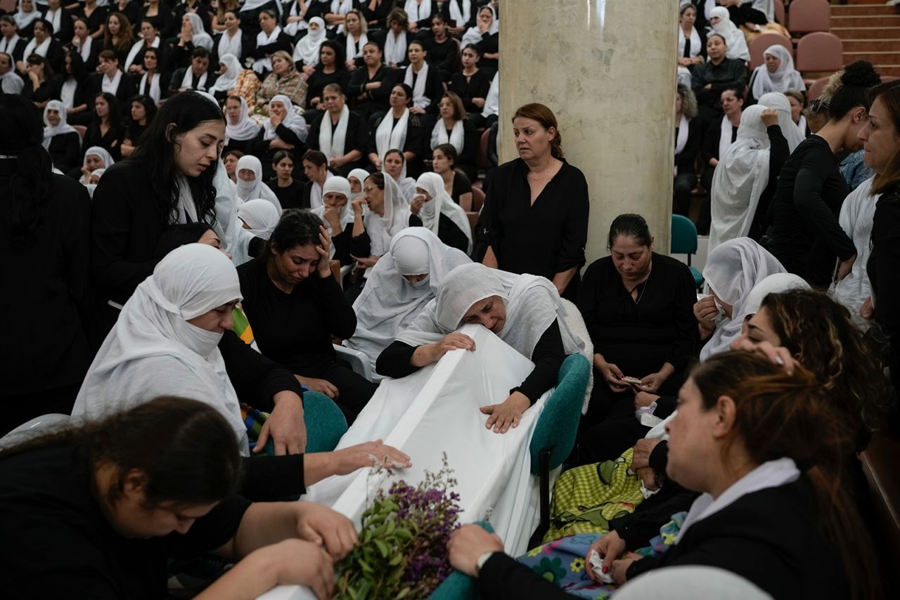 Members of the Druze minority mourn during the funeral of their relatives on July 28.