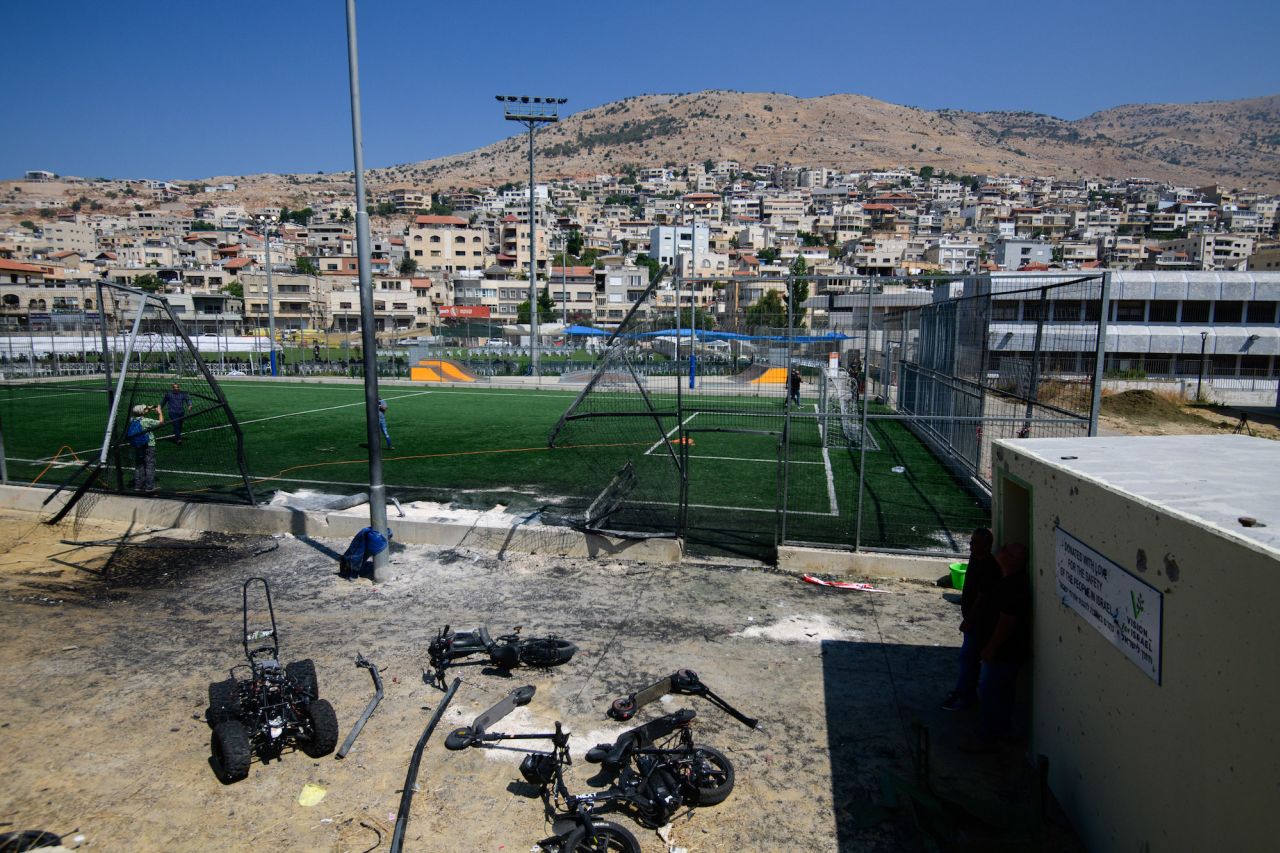 Damage from a rocket is seen at a football field in Majdal Shams, Golan Heights, on Sunday.