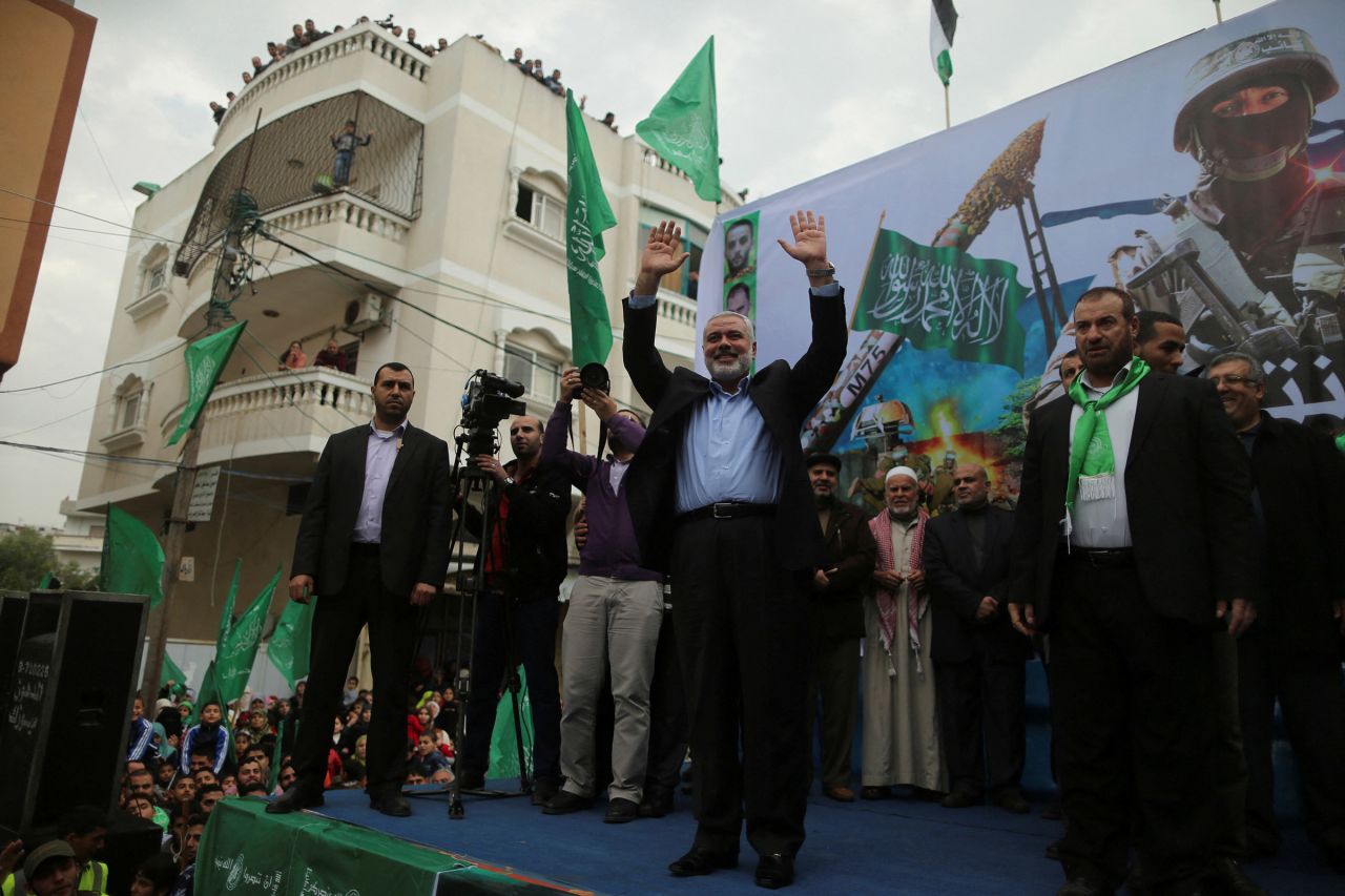 In this 2014 file photo, senior Hamas leader Ismail Haniyeh waves to the crowd during a rally ahead of the 27th anniversary of Hamas' founding, in Jabaliya in the northern Gaza Strip. 