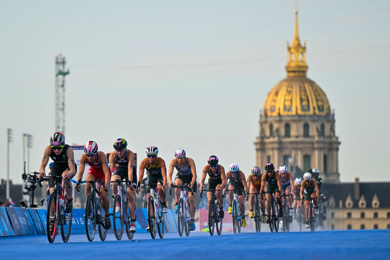 Athletes compete in the cycling race during the women's individual triathlon at the Paris 2024 Olympic Games in central Paris on July 31. 