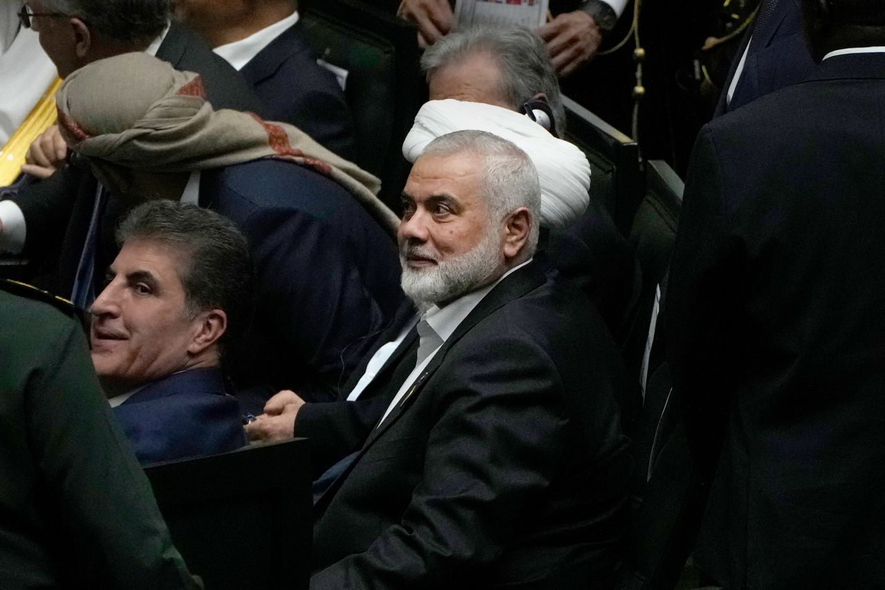 Hamas chief Ismail Haniyeh, center, sits prior to the start of the swearing-in ceremony of newly-elected Iranian President Masoud Pezeshkian at the Iranian parliament, in Tehran, Iran, on July 30.