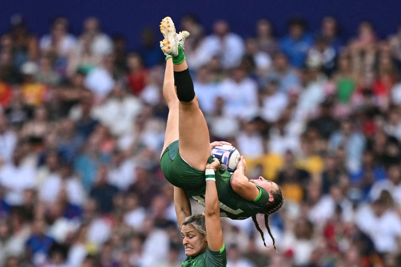 Ireland's Erin King lifts Emily Lane during a women's rugby sevens match against Britain at the Stade de France in Saint-Denis on Tuesday.