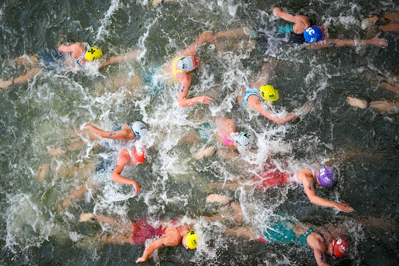 Athletes compete compete in the swim leg of the women's individual triathlon competition at the 2024 Summer Olympics, on July 31, in Paris, France. 